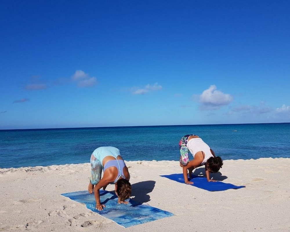 Beach-Yoga-Two-Women-in-Crow-Pose-Bakasana.jpg