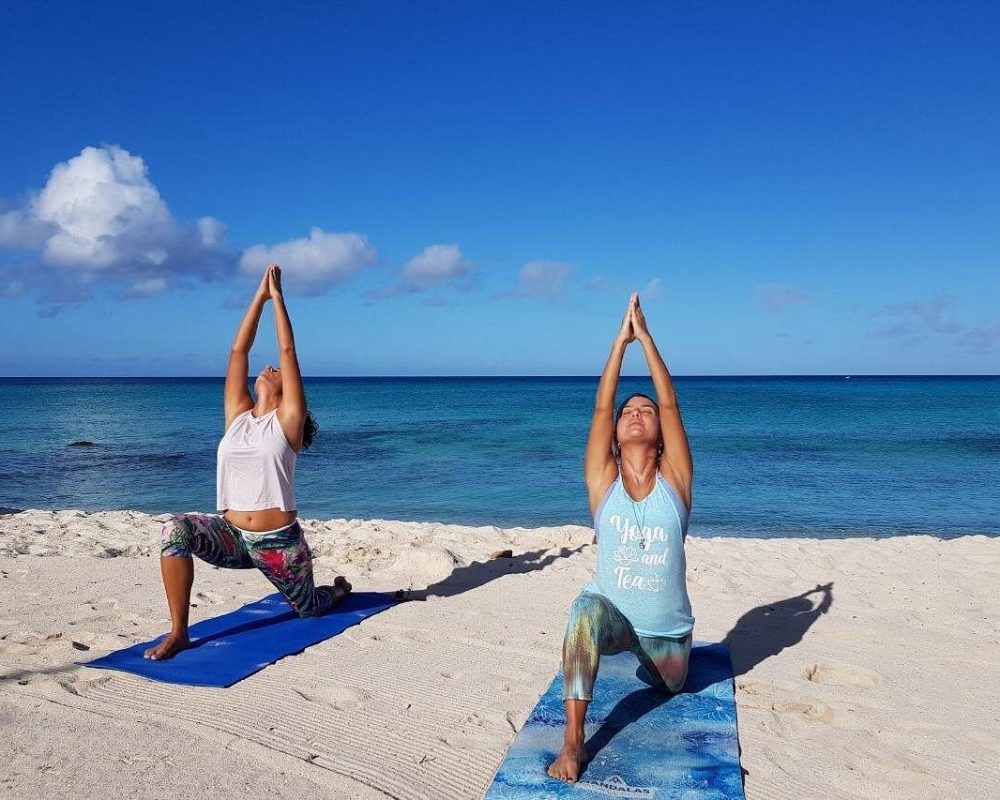 Beginner-Yoga-Low-Lunge-Pose-Anjaneyasana-on-the-Sand.jpg